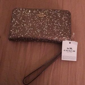 Coach glittery star wristlet with wallet inside